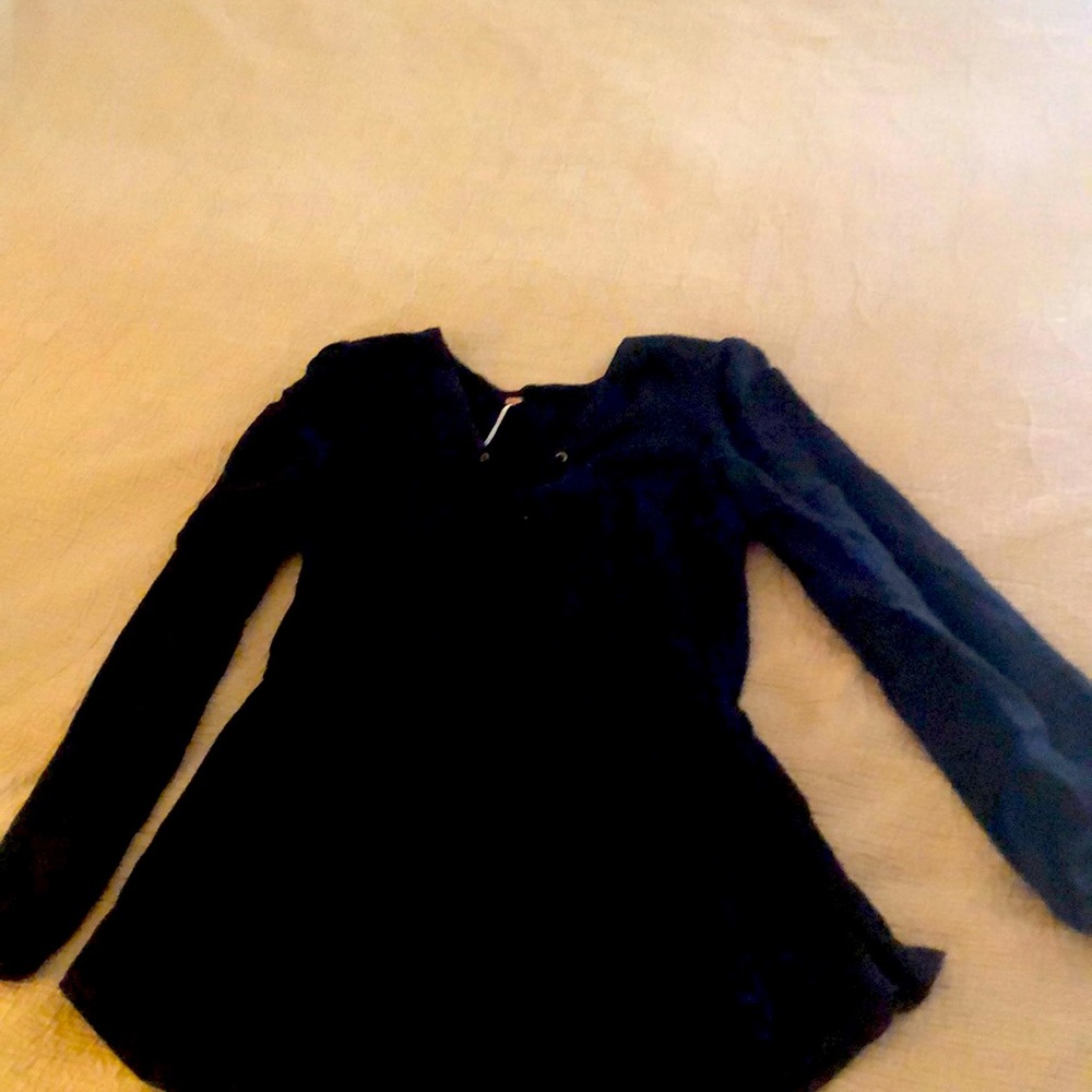 Free people black top with cinch waist.